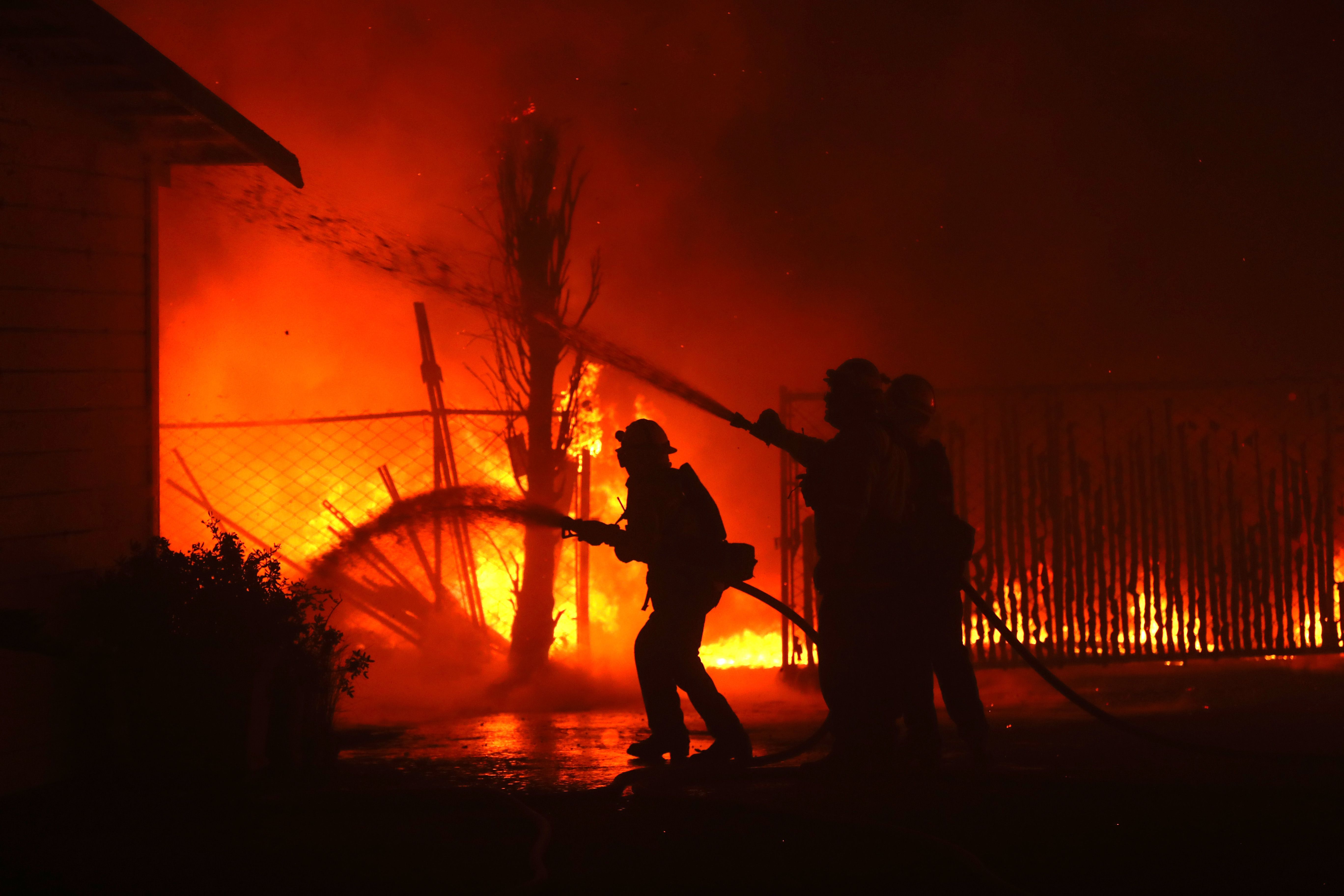 California wildfires intensify amid hurricane-force winds, forcing evacuations, energy shutoffs