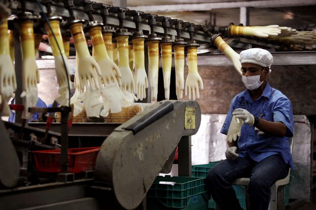 FOCUS-Virus battle in danger as world’s medical glove capital struggles with lockdown