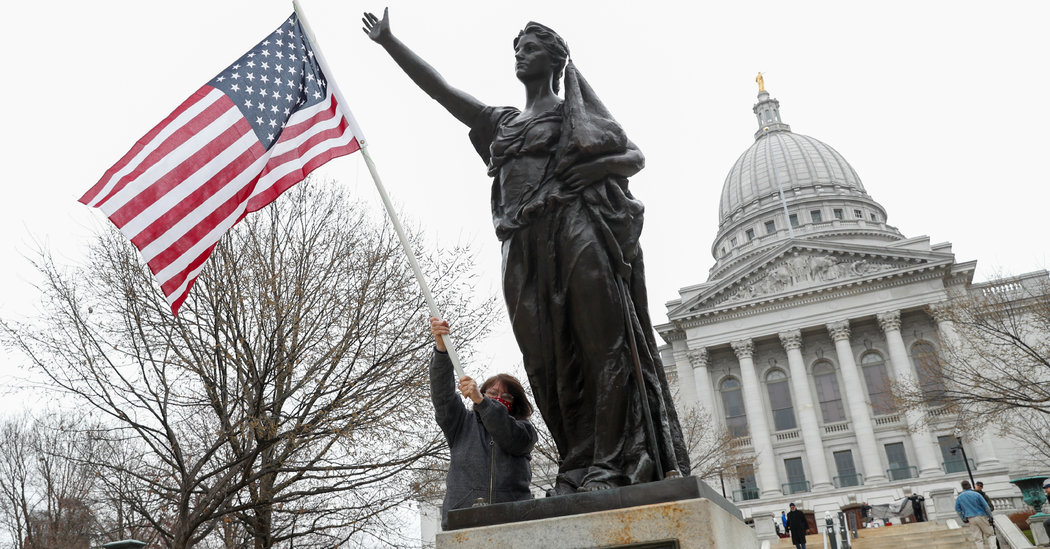 A number of Hundred Protest Keep-at-Dwelling Order at Wisconsin State Capitol