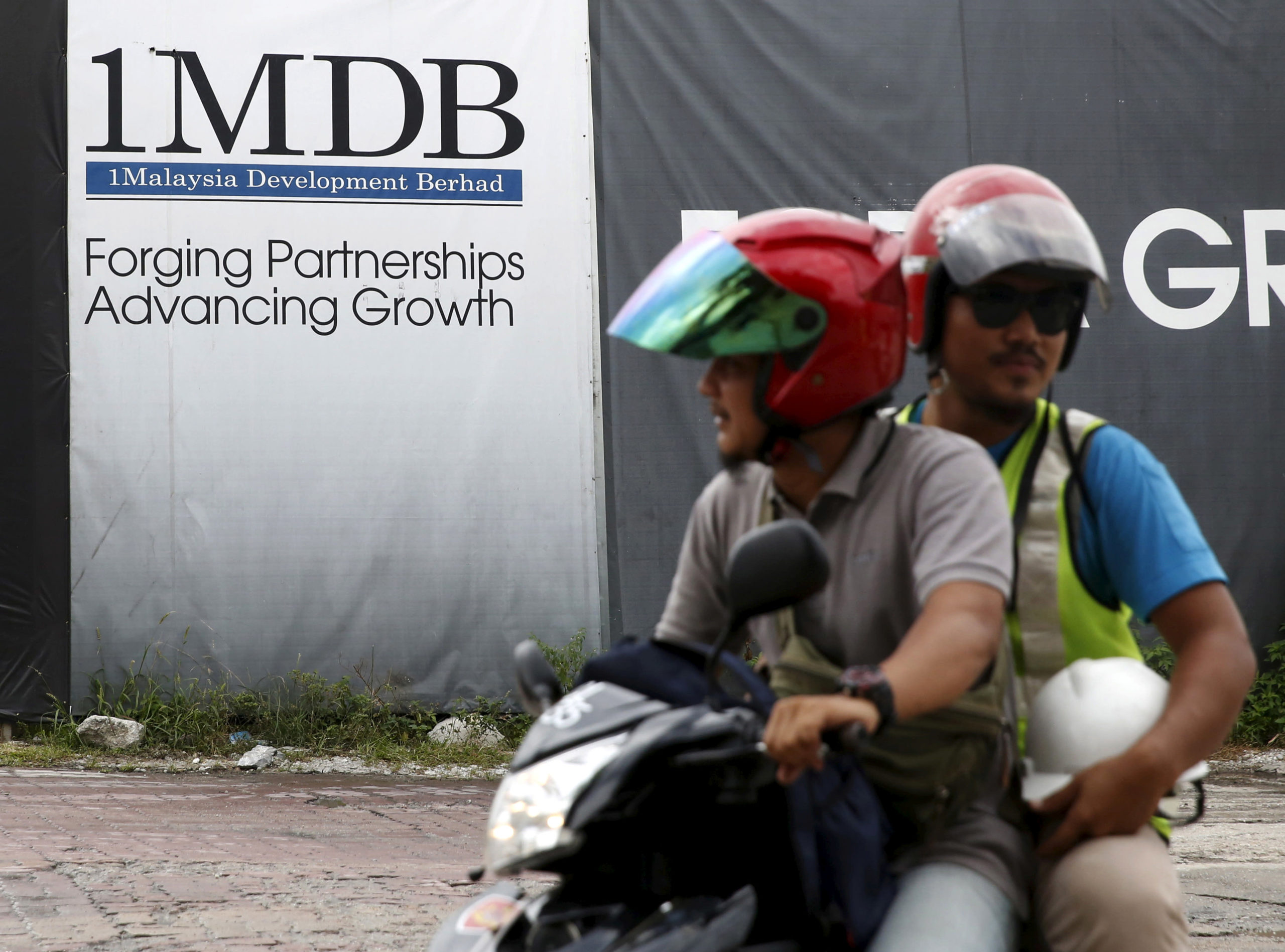 Goldman Sachs cuts earnings, citing provisions referring to the 1MDB scandal