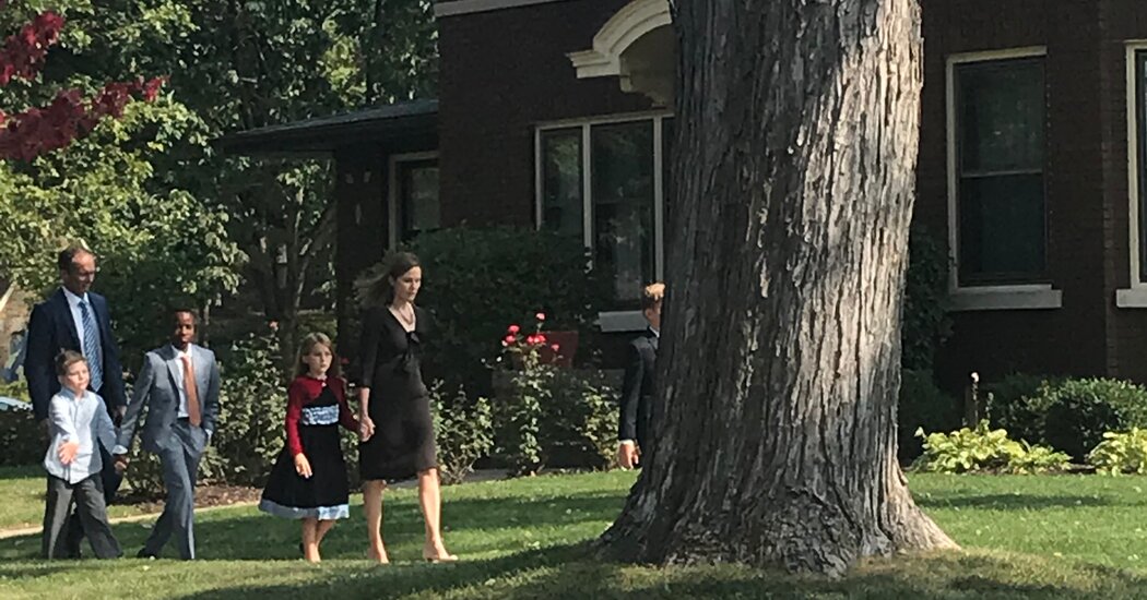 Barrett, with kids in tow, is seen leaving her Indiana residence.