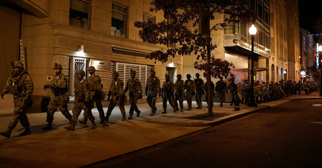 The inauguration stage is about, encircled by troopers and boundaries.