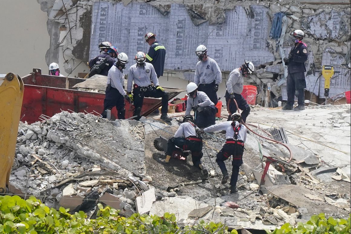 Crews spend fifth day atop shaky pile of collapsed concrete