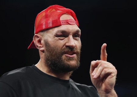 Boxing-Tyson urges Fury to fight on amid retirement rumors