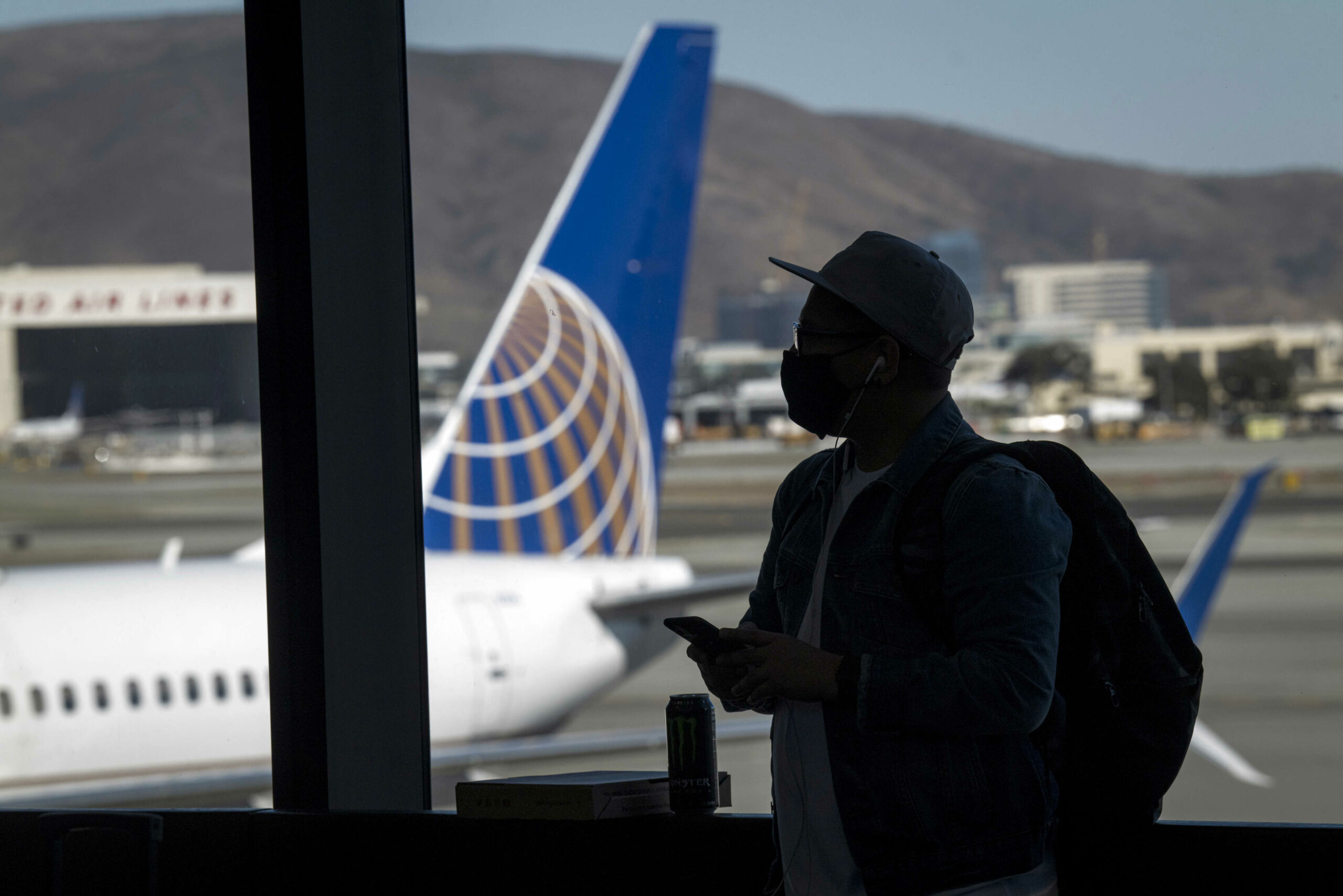 United, Delta cancel dozens of Christmas Eve flights as Covid hits crews
