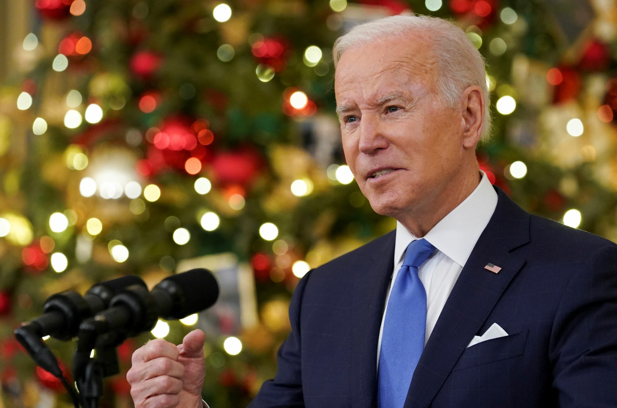 Biden says vaccinated can safely celebrate holidays as omicron spreads