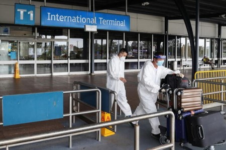 Australia reopens borders to non-citizens despite Omicron worries