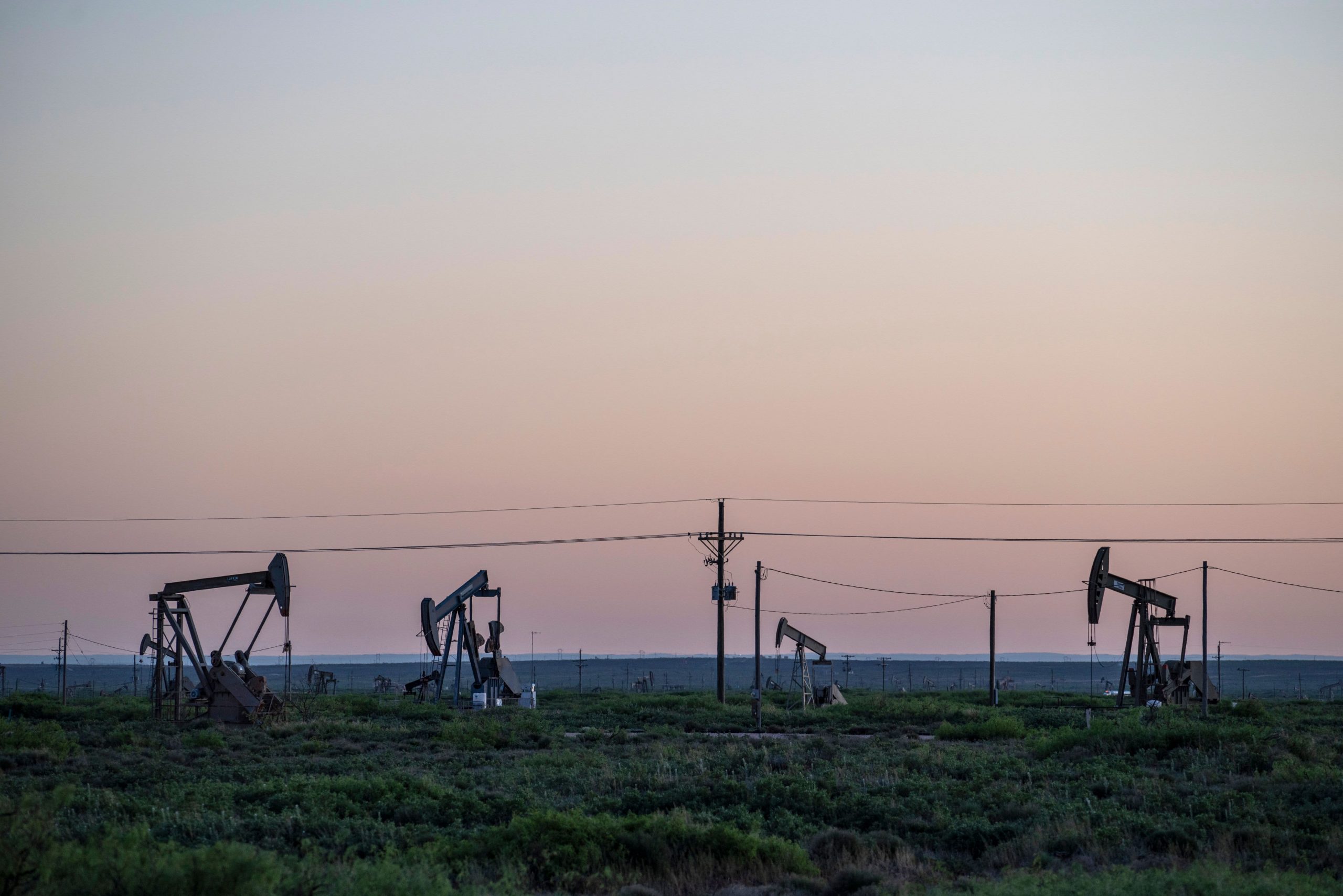 U.S. oil tumbles more than 8%, dips below $100 per barrel