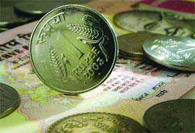 Rupee ends flat against US dollar amid forex outflows : The Tribune India