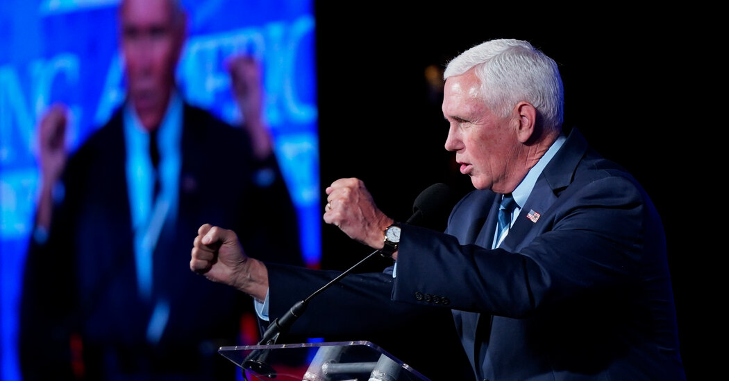 Mike Pence urges conservatives to look forward as a Trump-shaped cloud hovers behind him.