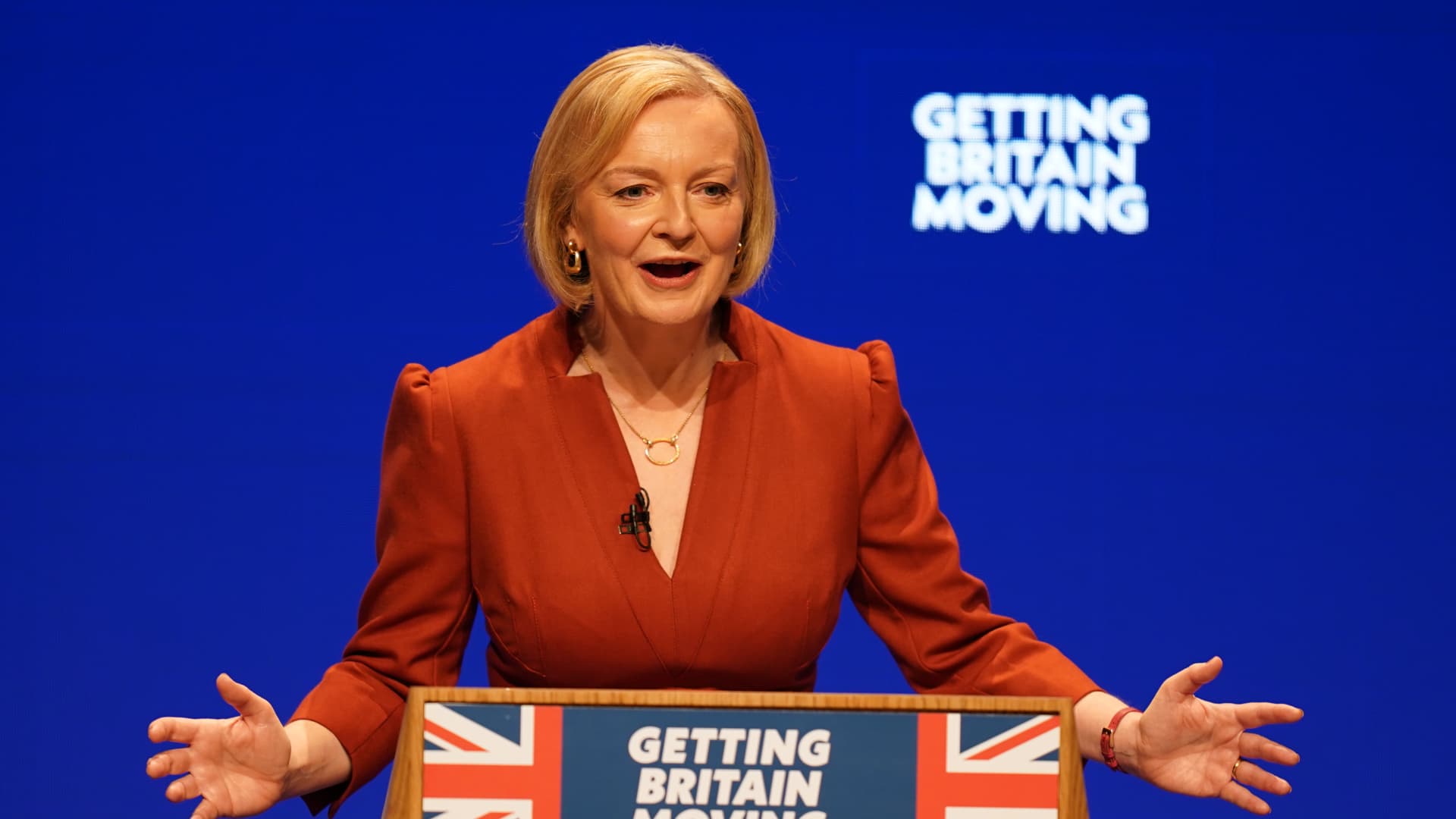 UK’s Liz Truss pledges tax-cutting future in speech plagued by protest