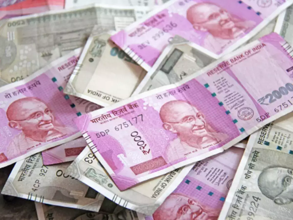 Rupee falls 14 paise to 82.35/USD amid sustained forex outflows