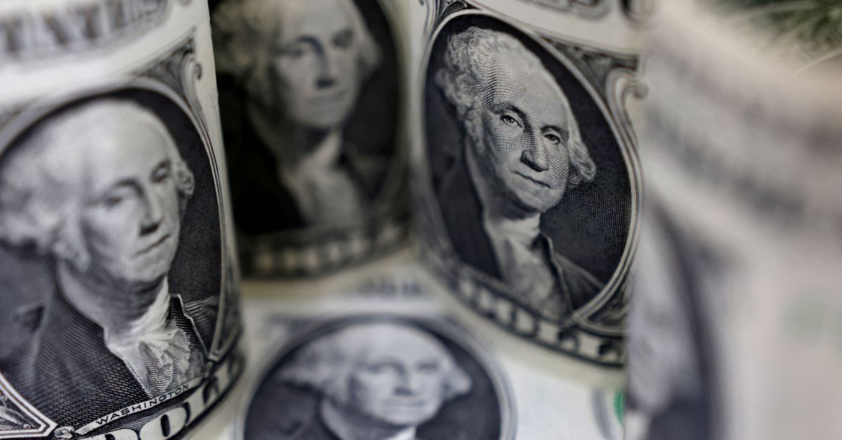 Dollar edges down as traders look to central banks for cues