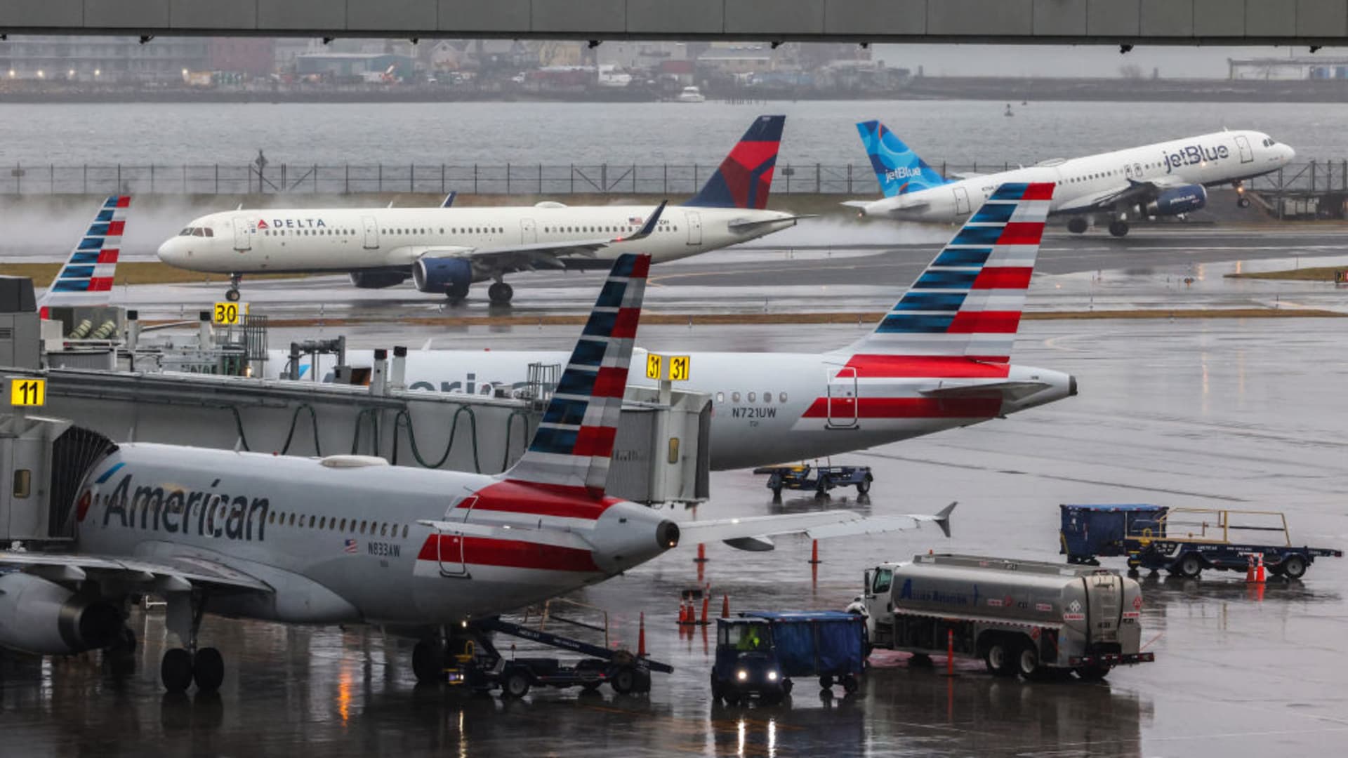 Airline stocks tumble after Delta trims profit forecast