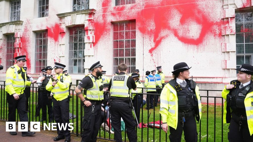 Protesters spray red paint on Ministry of Defence