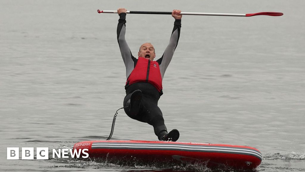 Ed Davey takes a dip in Lake Windermere