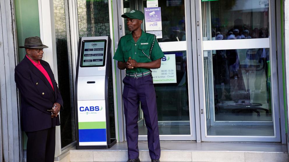 Zimbabwe authorities mix charm with force in an attempt to shore up the world’s newest currency