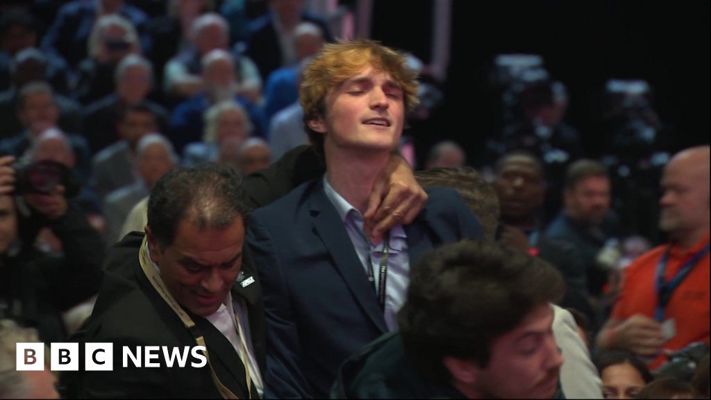Protester dragged out after interrupting Reeves speech